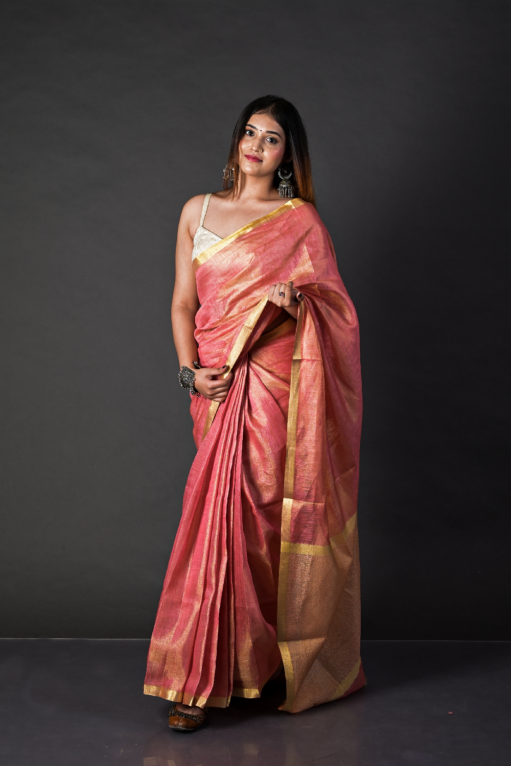 Tissue Linen saree crafted to celebrate timeless Indian craftsmanship with a contemporary touch.