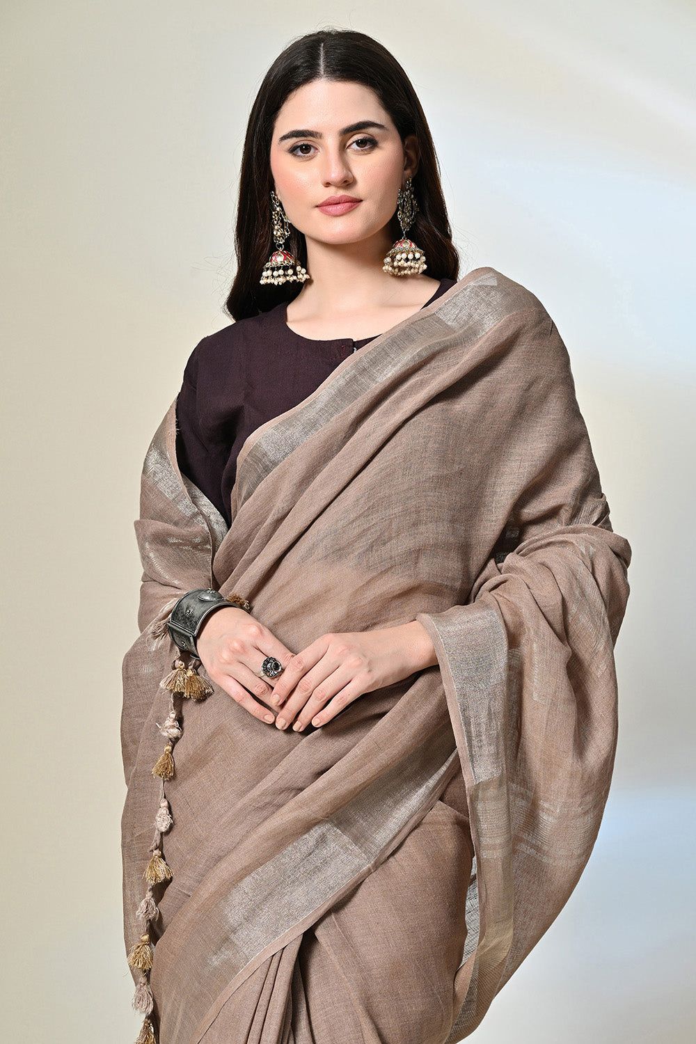 Elegant rust grey, 6.5 mtr. long brown linen saree naturally dyed with catechu, promoting sustainable and organic fashion.