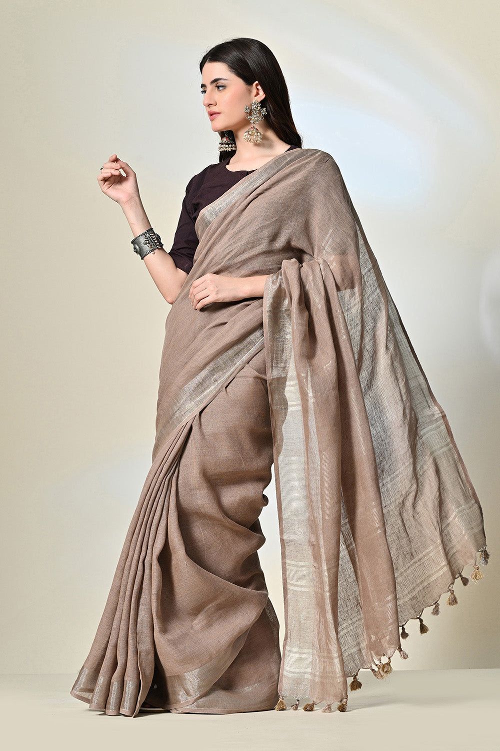 Elegant rust grey, 6.5 mtr. long brown linen saree naturally dyed with catechu, promoting sustainable and organic fashion.
