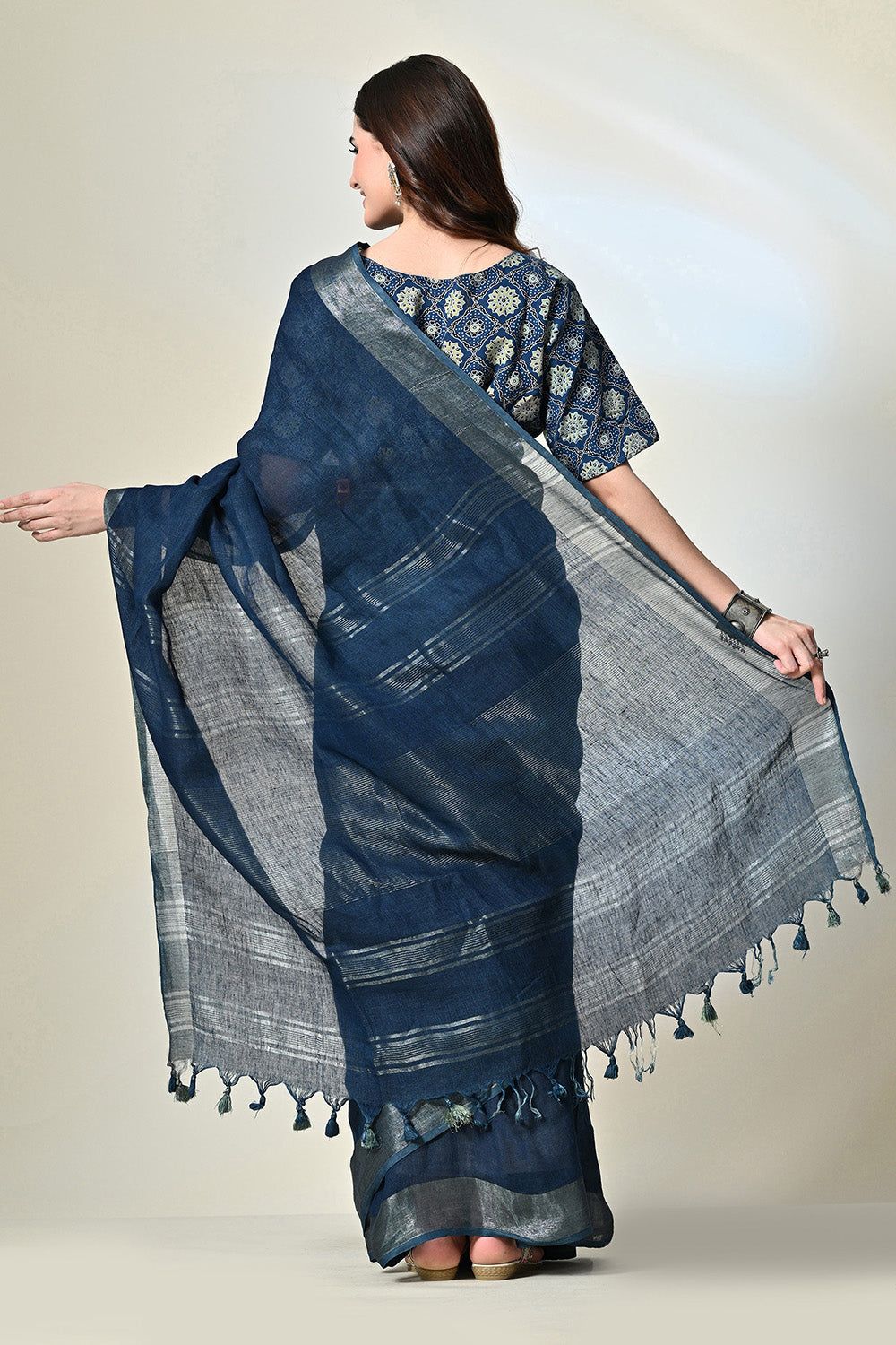 Dark indigo organic linen saree, dyed with natural indigofera tinctoria, ready for a dry clean wash. Handwoven luxury eco-friendly saree available online.