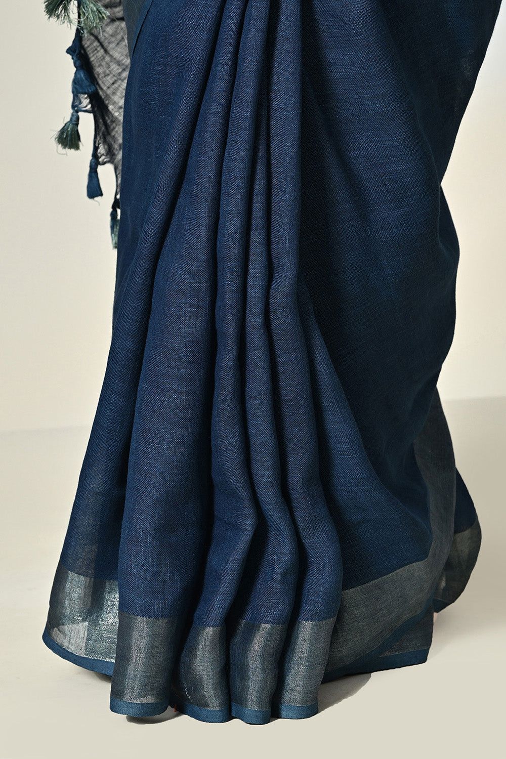 Dark indigo organic linen saree, dyed with natural indigofera tinctoria, ready for a dry clean wash. Handwoven luxury eco-friendly saree available online.