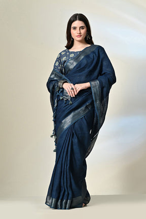 Dark indigo organic linen saree, dyed with natural indigofera tinctoria, ready for a dry clean wash. Handwoven luxury eco-friendly saree available online.