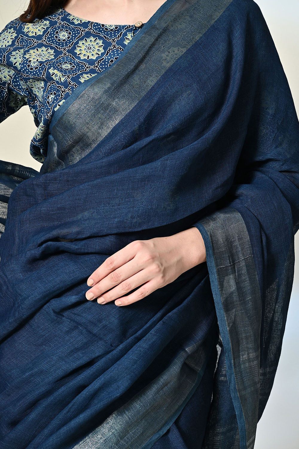 Dark indigo organic linen saree, dyed with natural indigofera tinctoria, ready for a dry clean wash. Handwoven luxury eco-friendly saree available online.