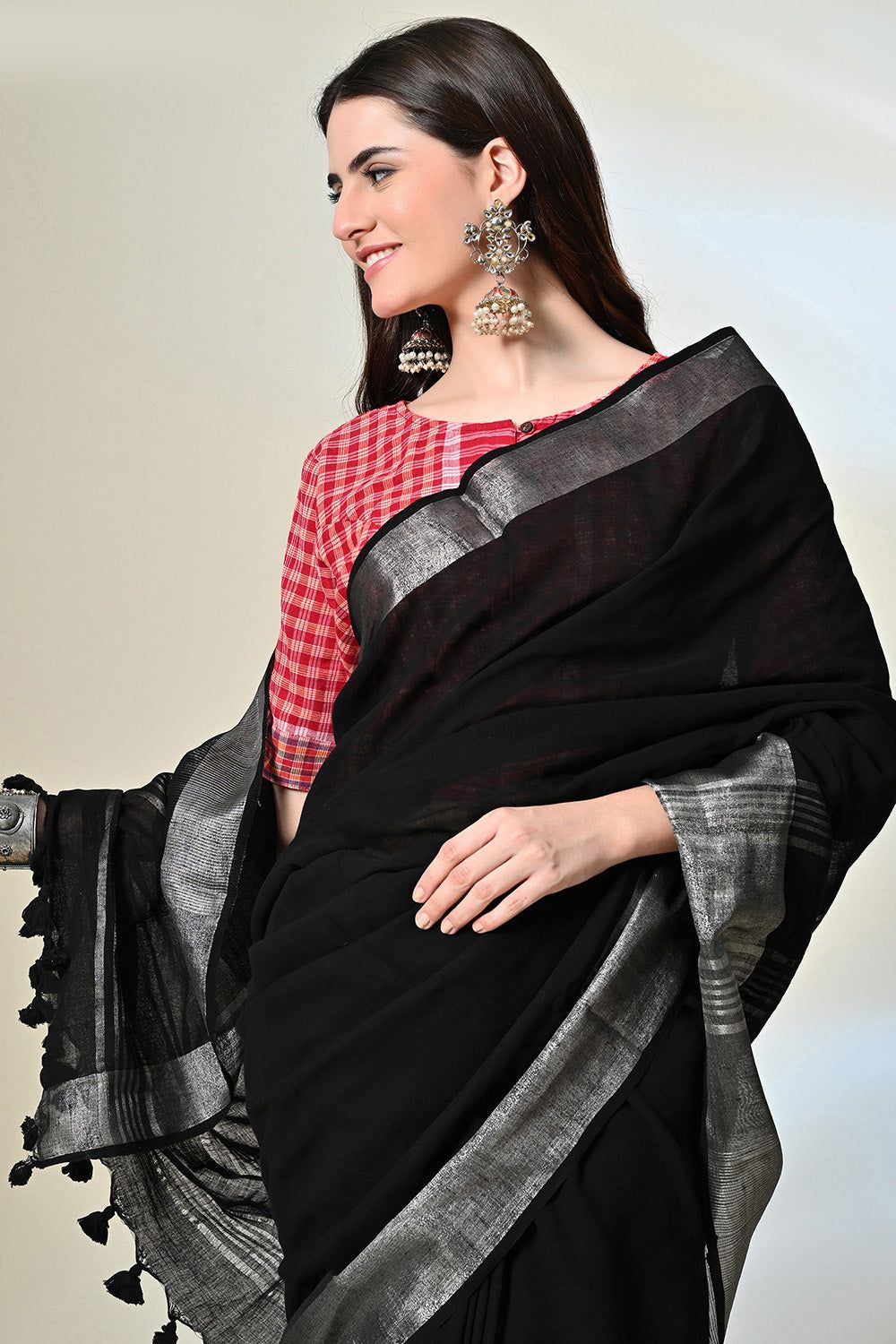 Black pure linen saree of 6.5 mtr length, dyed naturally with Myrobalan and fermented iron water, suitable for dry cleaning