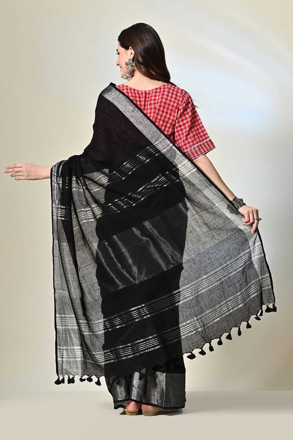 Black pure linen saree of 6.5 mtr length, dyed naturally with Myrobalan and fermented iron water, suitable for dry cleaning