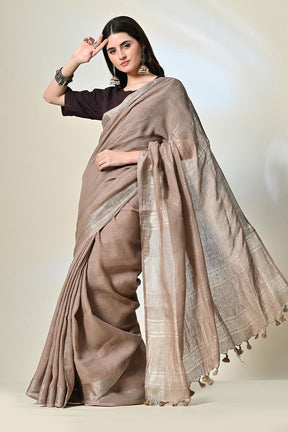 Elegant rust grey, 6.5 mtr. long brown linen saree naturally dyed with catechu, promoting sustainable and organic fashion.