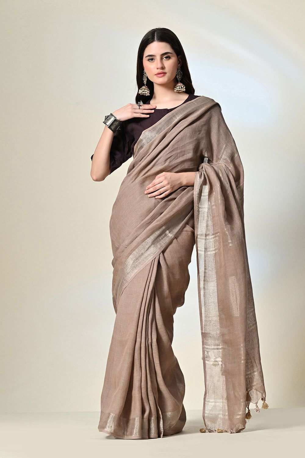 Elegant rust grey, 6.5 mtr. long brown linen saree naturally dyed with catechu, promoting sustainable and organic fashion.