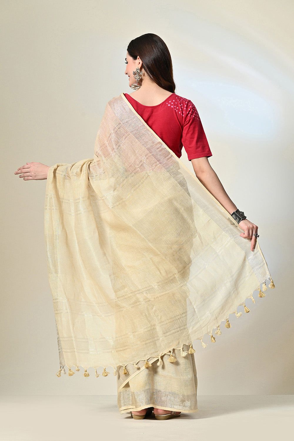 Eco-conscious light yellow linen saree with natural pomegranate dye, part of biodegradable fashion range, dry clean to maintain quality