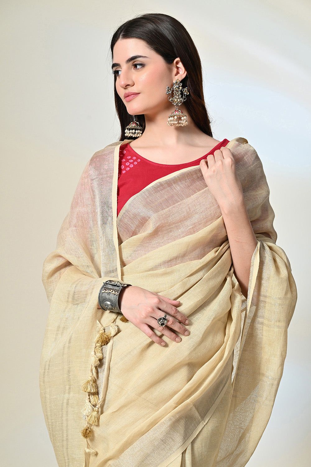 Eco-conscious light yellow linen saree with natural pomegranate dye, part of biodegradable fashion range, dry clean to maintain quality