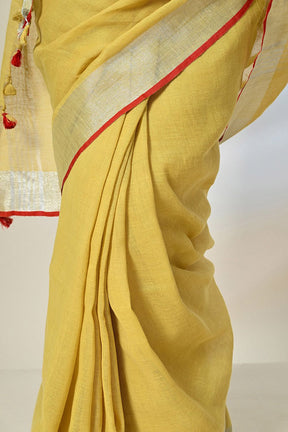 Mustard Linen saree of 6.5 mtr length, dyed with organic pomegranate in natural dyeing methods, ideal for vegan and eco-textile trend lovers.